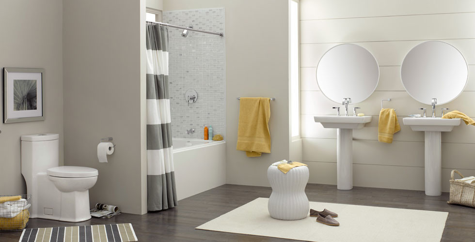 Medium sized classic ensuite bathroom in Other with an alcove bath, a shower/bath combination, a one-piece toilet, grey tiles, mosaic tiles, white walls, dark hardwood flooring, a pedestal sink, brown floors and a shower curtain.