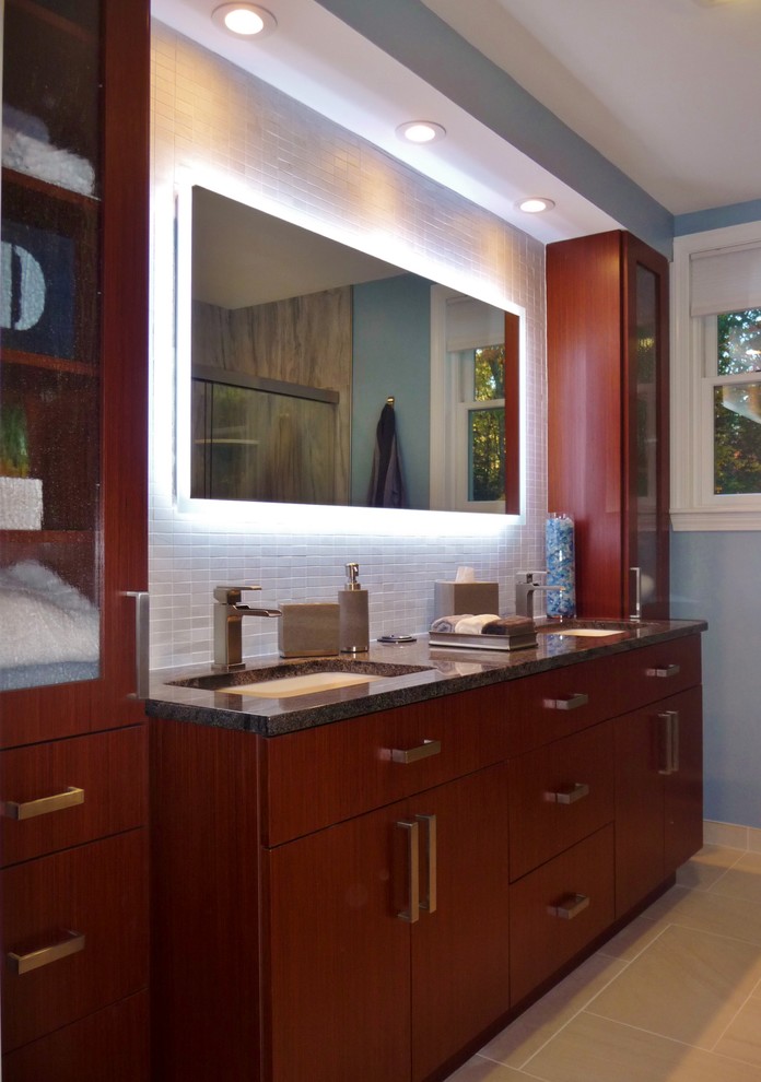 Inspiration for a medium sized traditional ensuite bathroom in Boston with flat-panel cabinets, medium wood cabinets, a double shower, a two-piece toilet, grey tiles, stone tiles, blue walls, porcelain flooring, a submerged sink and granite worktops.