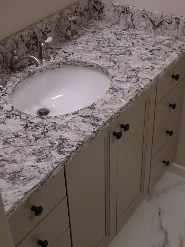 This is an example of a medium sized classic bathroom in Boston with a submerged sink, recessed-panel cabinets, grey cabinets, engineered stone worktops and white tiles.