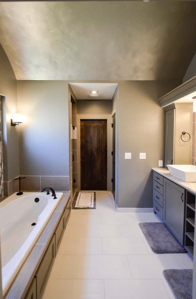 Inspiration for a large transitional master white tile and ceramic tile ceramic tile bathroom remodel in Kansas City with a vessel sink, shaker cabinets, gray cabinets, quartz countertops and gray walls