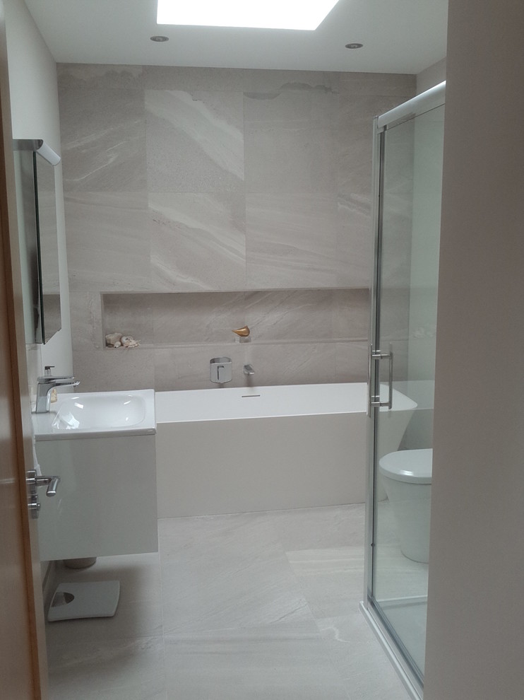 This is an example of a beach style bathroom in Belfast with porcelain flooring.