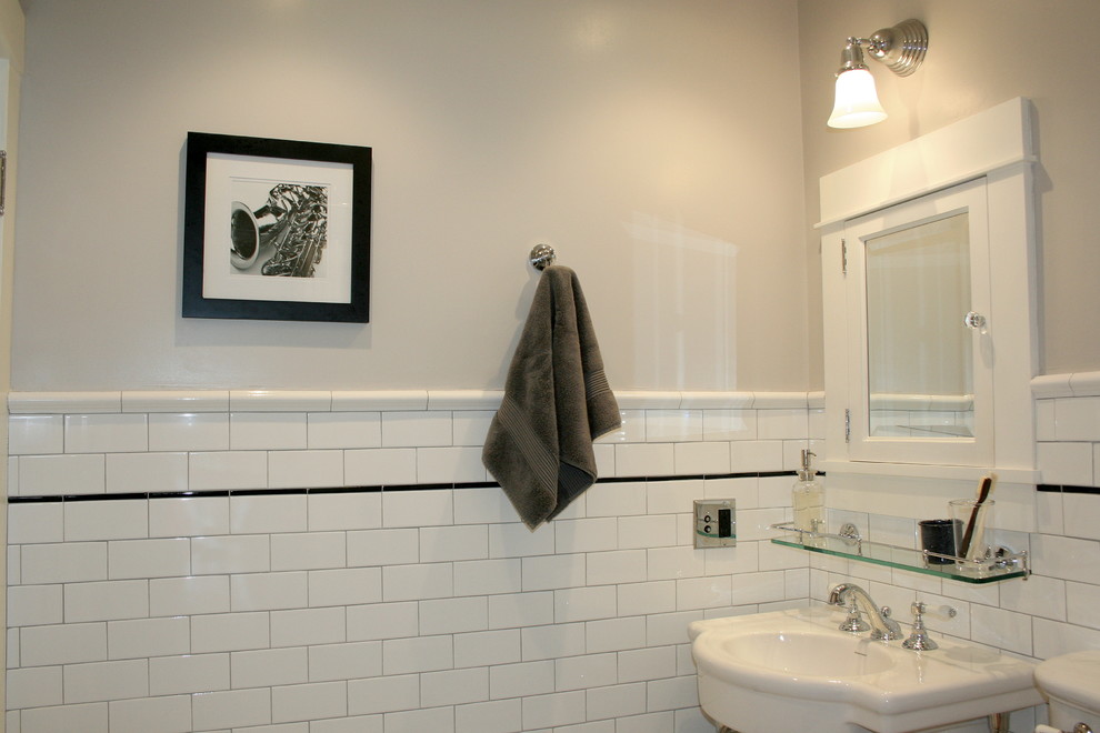 Small traditional ensuite bathroom in San Francisco with a pedestal sink, a two-piece toilet, white tiles, ceramic tiles, white walls and mosaic tile flooring.