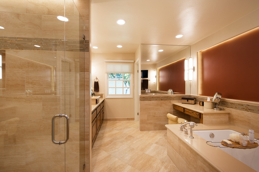 Walk-in shower - large traditional master beige tile and glass tile travertine floor walk-in shower idea in Orange County with raised-panel cabinets, dark wood cabinets, an undermount tub, a one-piece toilet, beige walls, an undermount sink and quartz countertops