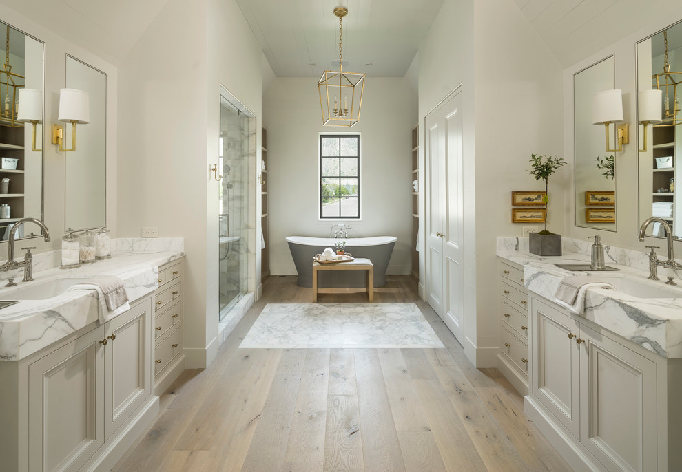 Example of a classic master light wood floor bathroom design in Salt Lake City with gray cabinets, white walls, an undermount sink and recessed-panel cabinets