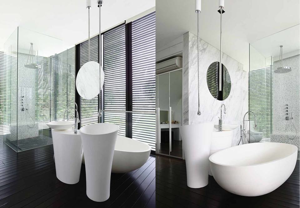 Example of a trendy dark wood floor bathroom design in Singapore with solid surface countertops, a wall-mount toilet and white walls