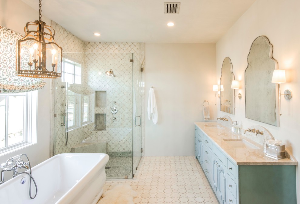 Large farmhouse beige tile and terra-cotta tile terra-cotta tile bathroom photo in Austin with blue cabinets, beige walls, an undermount sink, quartzite countertops, a hinged shower door and beige countertops