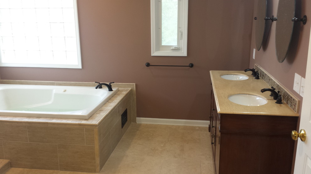 Design ideas for a large classic ensuite bathroom in Detroit with flat-panel cabinets, dark wood cabinets, granite worktops, beige tiles, cement tiles, brown walls and ceramic flooring.