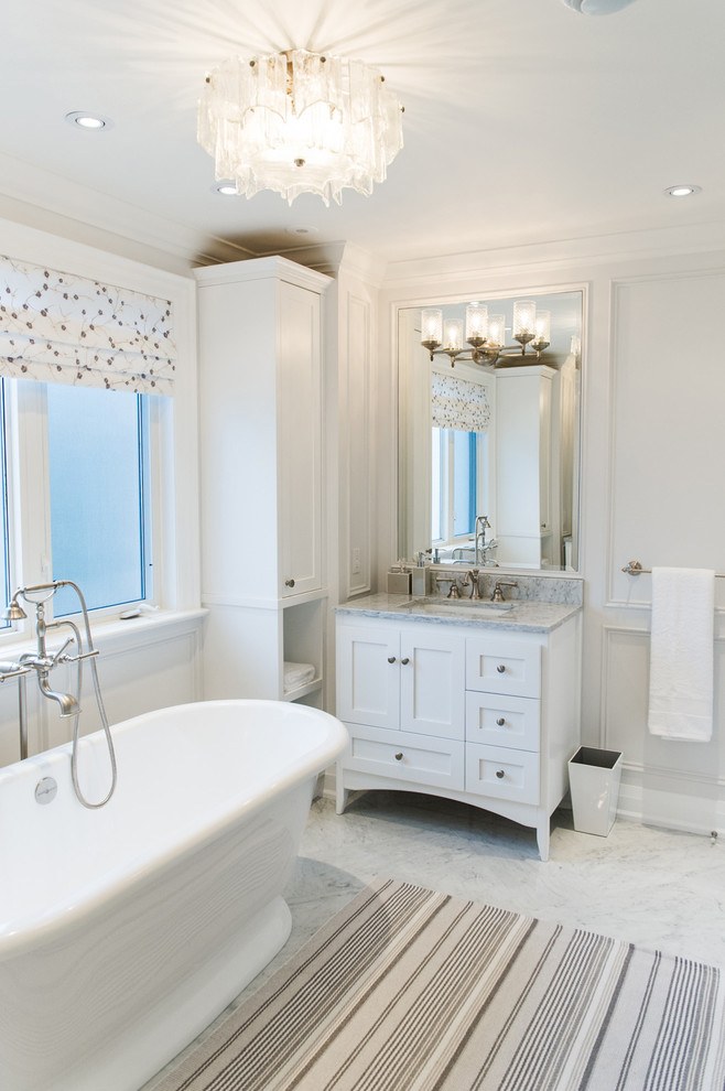 Inspiration for a large contemporary master marble floor and multicolored floor bathroom remodel in Toronto with furniture-like cabinets, white cabinets, white walls, an undermount sink, marble countertops, a hinged shower door and multicolored countertops