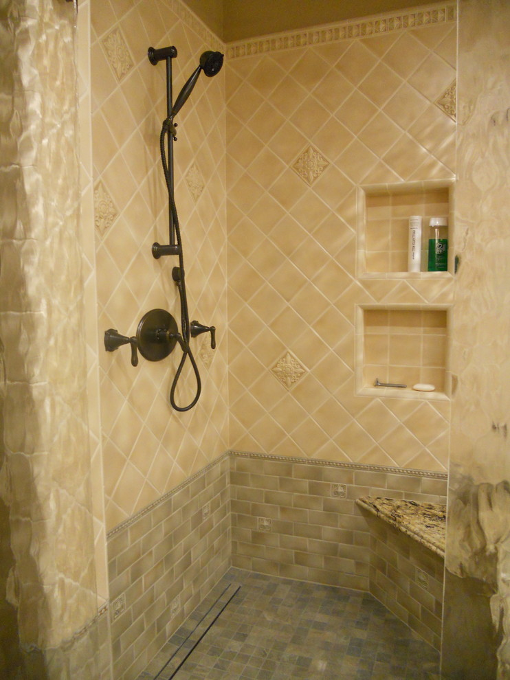 Bathroom - large traditional master beige tile and ceramic tile slate floor and gray floor bathroom idea in San Francisco with raised-panel cabinets, beige cabinets, a two-piece toilet, beige walls, an undermount sink, granite countertops, a hinged shower door and beige countertops