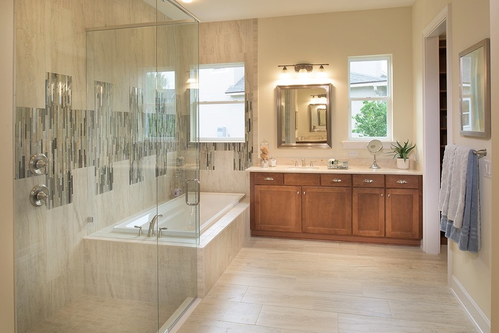 This is an example of a medium sized classic ensuite bathroom in Jacksonville with a corner shower, beige tiles, ceramic tiles, yellow walls, porcelain flooring, a built-in sink, granite worktops, dark wood cabinets, shaker cabinets and a built-in bath.