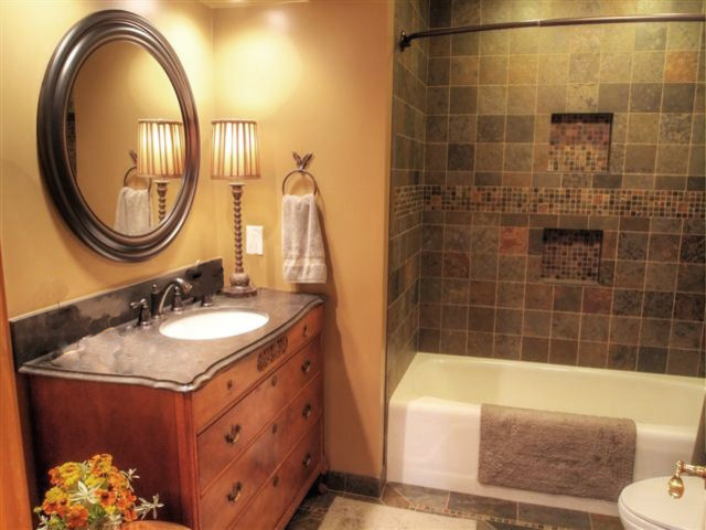 Small elegant gray tile slate floor bathroom photo in Boise with furniture-like cabinets, medium tone wood cabinets and brown walls