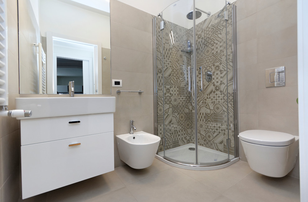 Corner shower - small contemporary master beige tile and ceramic tile ceramic tile corner shower idea in Milan with an integrated sink, a wall-mount toilet and white walls