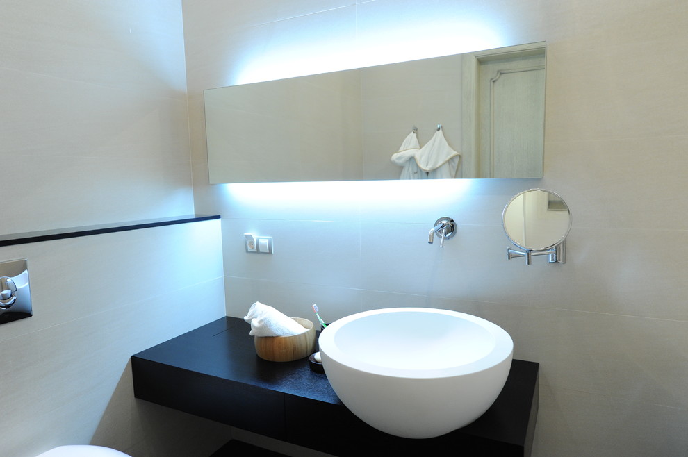 Photo of a contemporary bathroom in Other with a vessel sink.