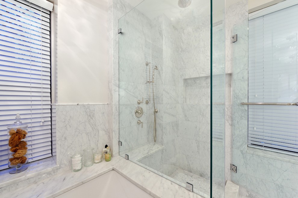Large trendy gray tile and stone tile marble floor bathroom photo in New York with an integrated sink, raised-panel cabinets, dark wood cabinets, marble countertops, a two-piece toilet and white walls