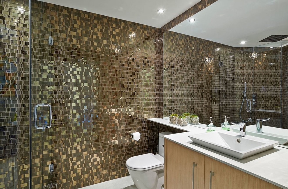 Wet room - mid-sized modern master metal tile wet room idea in Other with flat-panel cabinets, beige cabinets, a one-piece toilet, a vessel sink, quartz countertops and a hinged shower door