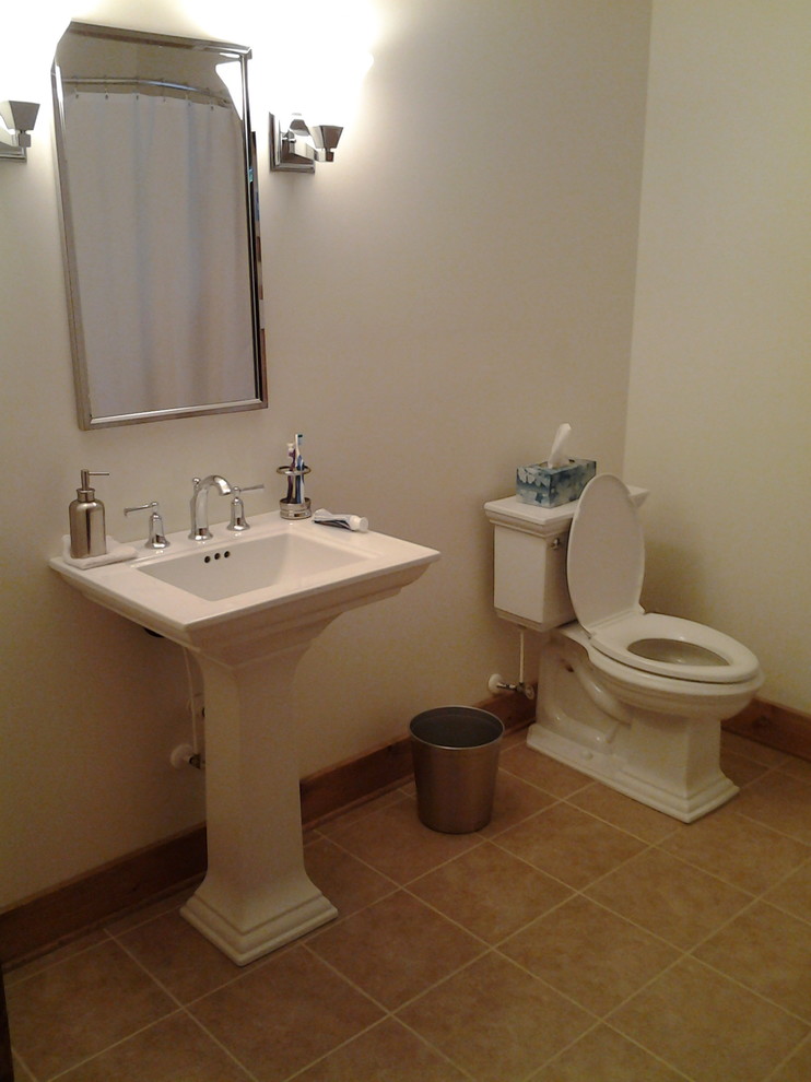 Photo of a medium sized farmhouse shower room bathroom in Charlotte with a corner shower, a two-piece toilet, white walls, travertine flooring and a pedestal sink.