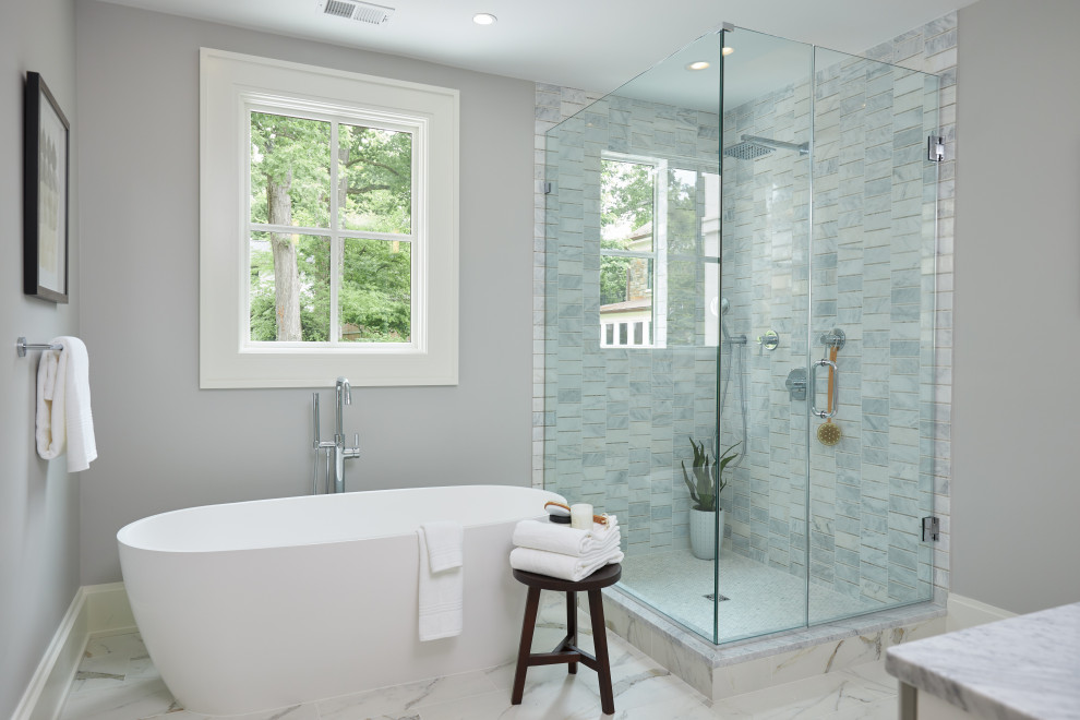 Inspiration for a transitional master gray tile and white tile multicolored floor bathroom remodel in DC Metro with gray walls, marble countertops, a hinged shower door and gray countertops