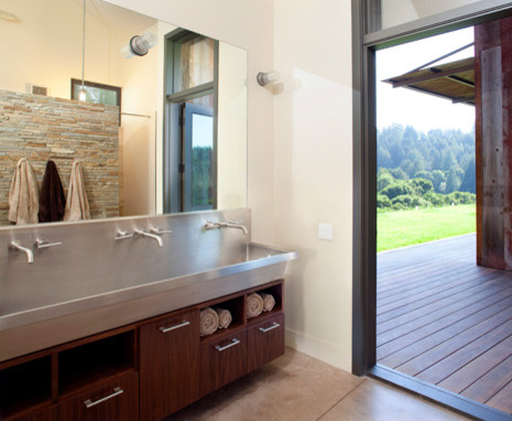 Идея дизайна: ванная комната среднего размера в стиле модернизм с раковиной с несколькими смесителями, темными деревянными фасадами, столешницей из нержавеющей стали, серой плиткой, каменной плиткой и белыми стенами