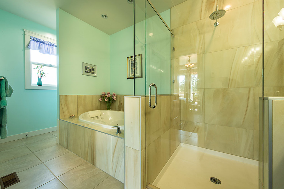 This is an example of an expansive traditional ensuite bathroom in Vancouver with a submerged sink, recessed-panel cabinets, dark wood cabinets, granite worktops, a hot tub, a double shower, a two-piece toilet, beige tiles, porcelain tiles, green walls and porcelain flooring.