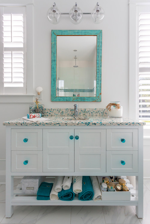 Beachy Vibes: Blue Bathroom Ideas with White Vanity and Blue Glass Knobs