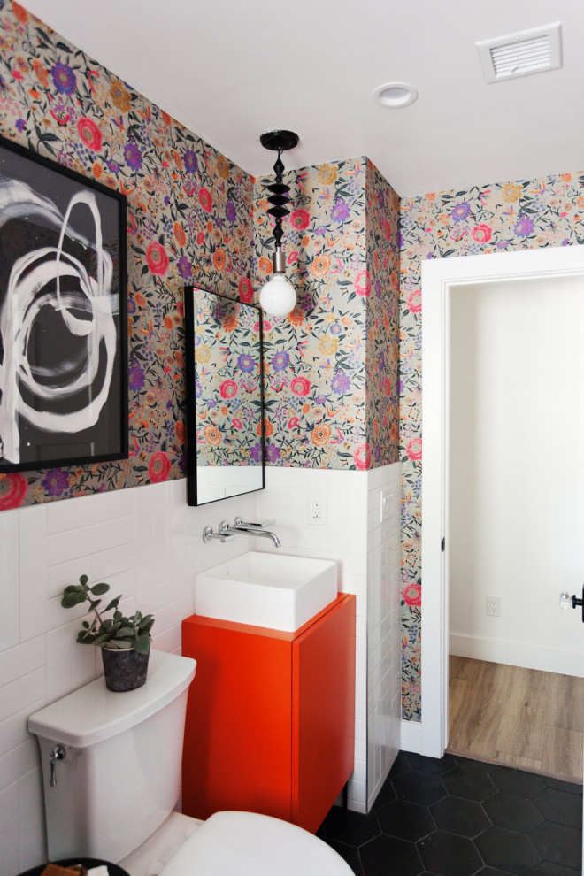 This is an example of a small bohemian shower room bathroom in Phoenix with flat-panel cabinets, orange cabinets, a walk-in shower, white tiles, ceramic tiles, multi-coloured walls, ceramic flooring, a vessel sink, laminate worktops, black floors, an open shower, orange worktops, a single sink, a freestanding vanity unit and wallpapered walls.