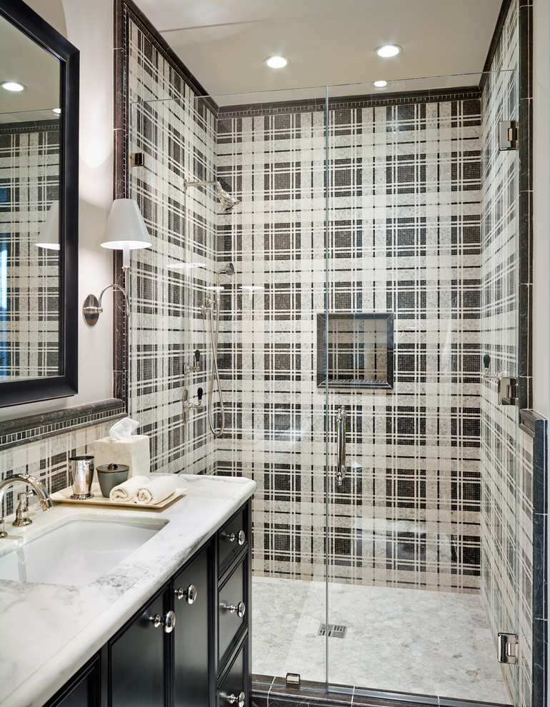 Mid-sized tuscan mosaic tile and black and white tile alcove shower photo in Phoenix with an undermount sink, recessed-panel cabinets, black cabinets, white walls and marble countertops