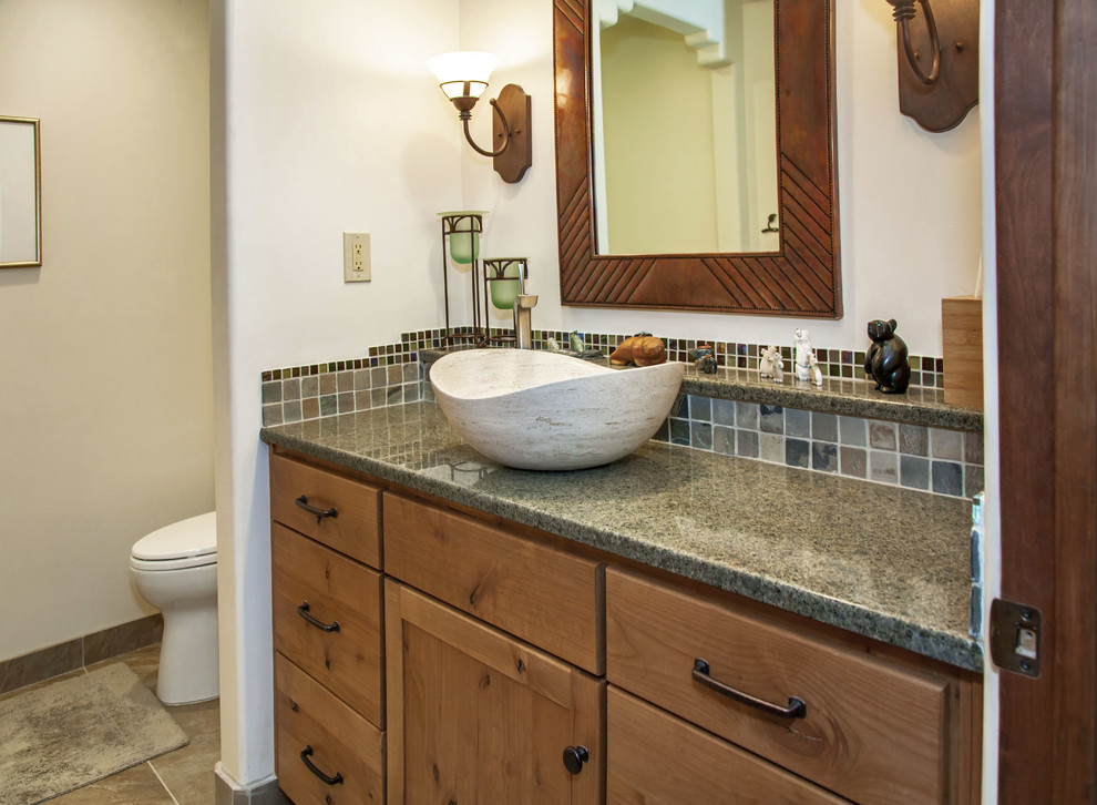 Medium sized traditional ensuite bathroom in Phoenix with recessed-panel cabinets, medium wood cabinets, ceramic tiles, beige walls, granite worktops, grey tiles, a built-in shower and a submerged sink.