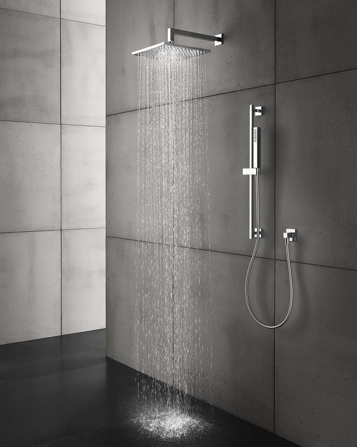 Esempio di una stanza da bagno padronale industriale con ante bianche, doccia ad angolo, WC sospeso, lavabo integrato e doccia aperta