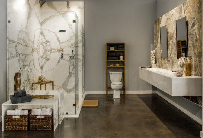 Inspiration for a transitional master concrete floor walk-in shower remodel in Dallas with gray walls, a wall-mount sink and a one-piece toilet