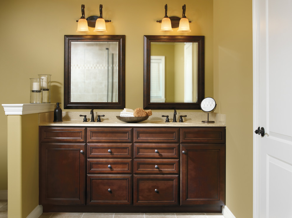 This is an example of a large contemporary ensuite bathroom in Indianapolis with recessed-panel cabinets, dark wood cabinets, yellow walls, a submerged sink and granite worktops.