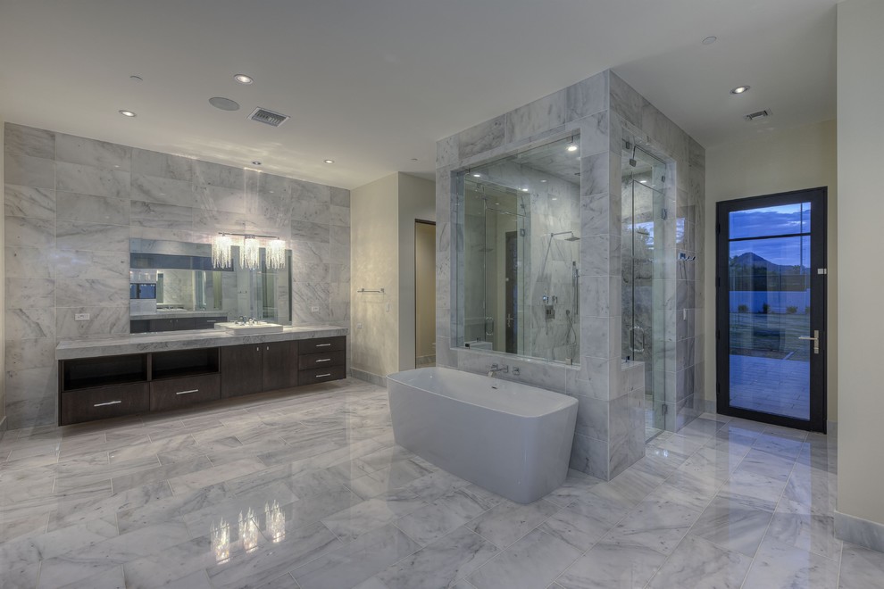 Design ideas for a large modern shower room bathroom in Phoenix with a vessel sink, flat-panel cabinets, brown cabinets, engineered stone worktops, a freestanding bath, a walk-in shower, a wall mounted toilet, multi-coloured tiles, porcelain tiles, white walls and medium hardwood flooring.