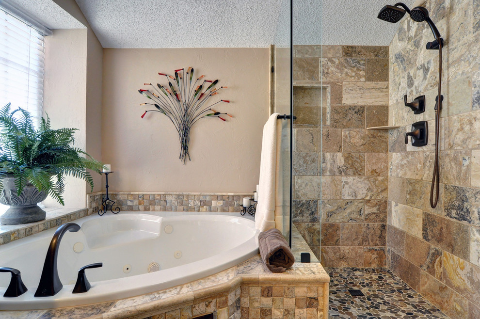 Inspiration for a timeless beige tile and stone tile bathroom remodel in Dallas with recessed-panel cabinets, dark wood cabinets and beige walls