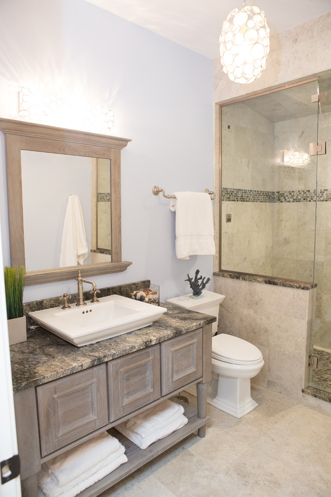 Mid-sized elegant 3/4 beige tile and porcelain tile porcelain tile and beige floor alcove shower photo in Chicago with recessed-panel cabinets, gray cabinets, a one-piece toilet, blue walls, a vessel sink, granite countertops, a hinged shower door and multicolored countertops