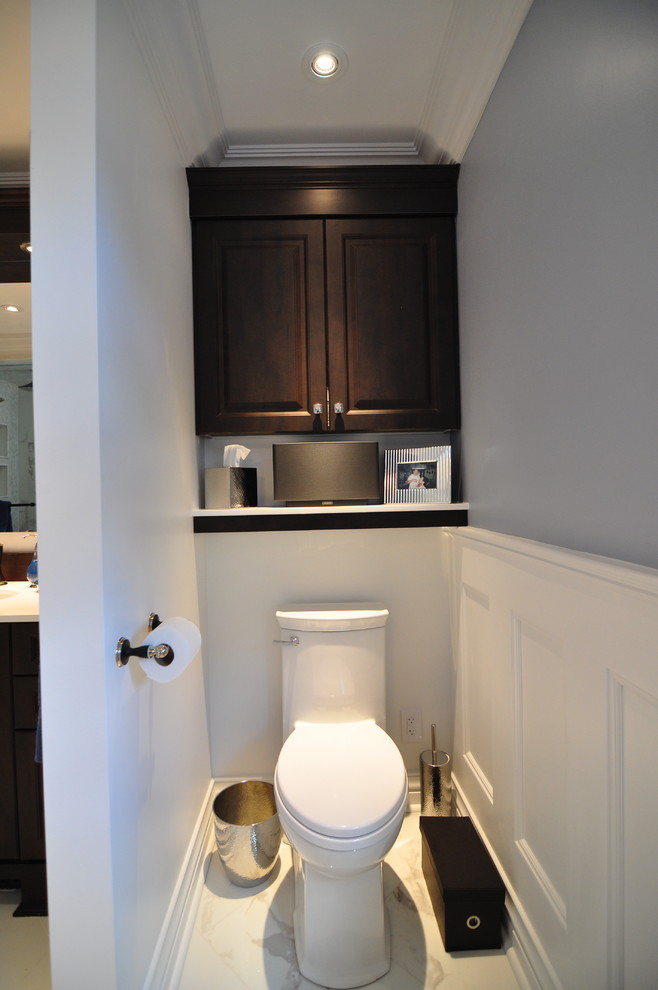 Photo of a medium sized classic cloakroom in Ottawa with a submerged sink, raised-panel cabinets, dark wood cabinets, engineered stone worktops, white tiles, mosaic tiles, multi-coloured walls and ceramic flooring.