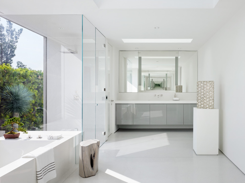Example of a large trendy master gray floor and double-sink bathroom design in Los Angeles with flat-panel cabinets, gray cabinets, white walls, an undermount sink, a hinged shower door, white countertops and a built-in vanity