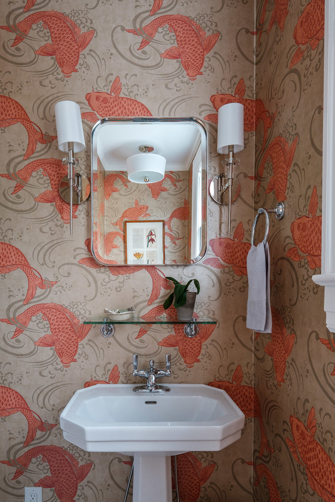 Esempio di un piccolo bagno di servizio bohémian con pareti arancioni e lavabo a colonna