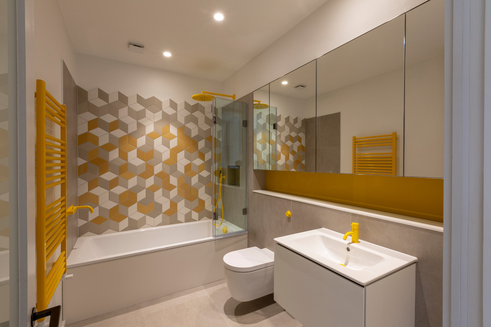 Inspiration for a medium sized contemporary grey and yellow bathroom in London with open cabinets, white cabinets, a wall mounted toilet, white walls, a vessel sink, wooden worktops, multi-coloured floors, a hinged door and beige worktops.