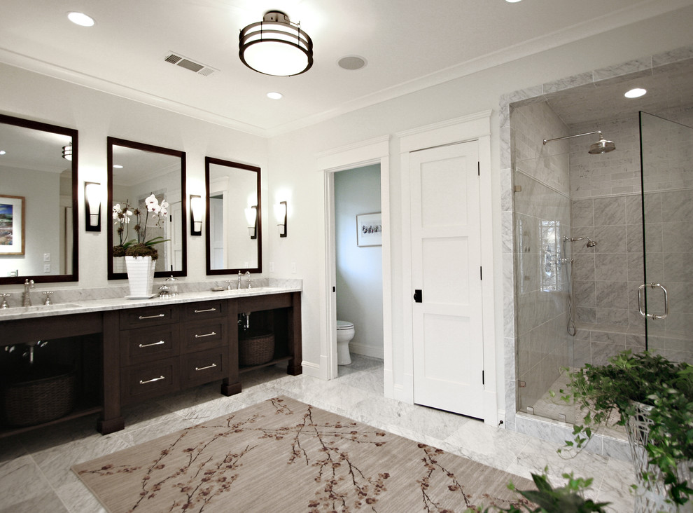 Photo of a classic bathroom in Atlanta with dark wood cabinets, an alcove shower, grey tiles, open cabinets and feature lighting.