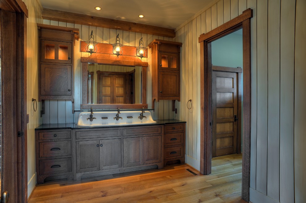 Bathroom - craftsman master medium tone wood floor bathroom idea in Other with beaded inset cabinets, dark wood cabinets and granite countertops