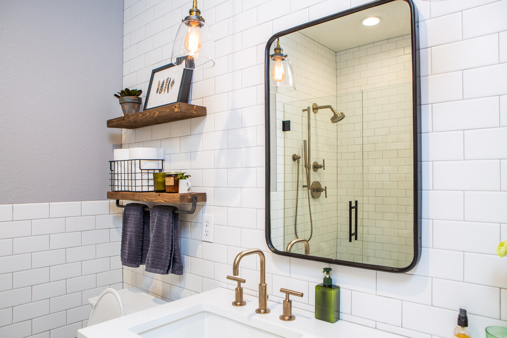 Example of a small transitional master white tile and ceramic tile cement tile floor and multicolored floor alcove shower design in Denver with flat-panel cabinets, gray cabinets, a one-piece toilet, gray walls, an undermount sink, quartz countertops, a hinged shower door and white countertops