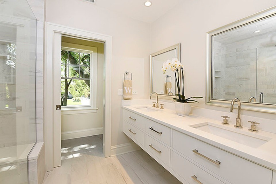 Alcove shower - mid-sized transitional master white tile and marble tile porcelain tile and white floor alcove shower idea in Chicago with flat-panel cabinets, white cabinets, gray walls, an undermount sink, quartz countertops, a hinged shower door and white countertops