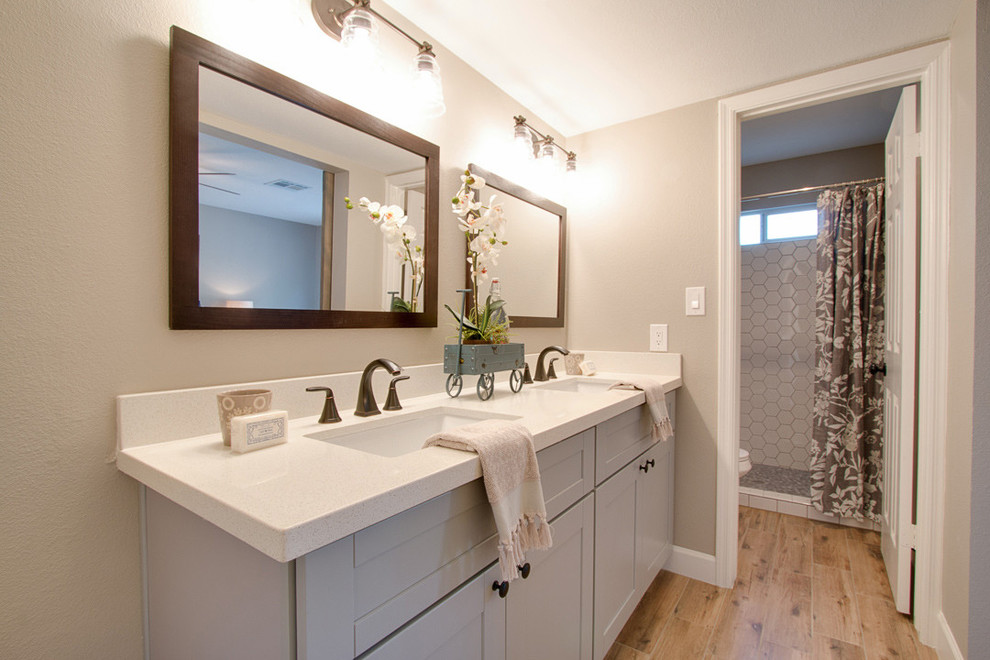 Mid-sized elegant master white tile and porcelain tile medium tone wood floor and beige floor bathroom photo in Los Angeles with shaker cabinets, gray cabinets, beige walls, an undermount sink and quartzite countertops