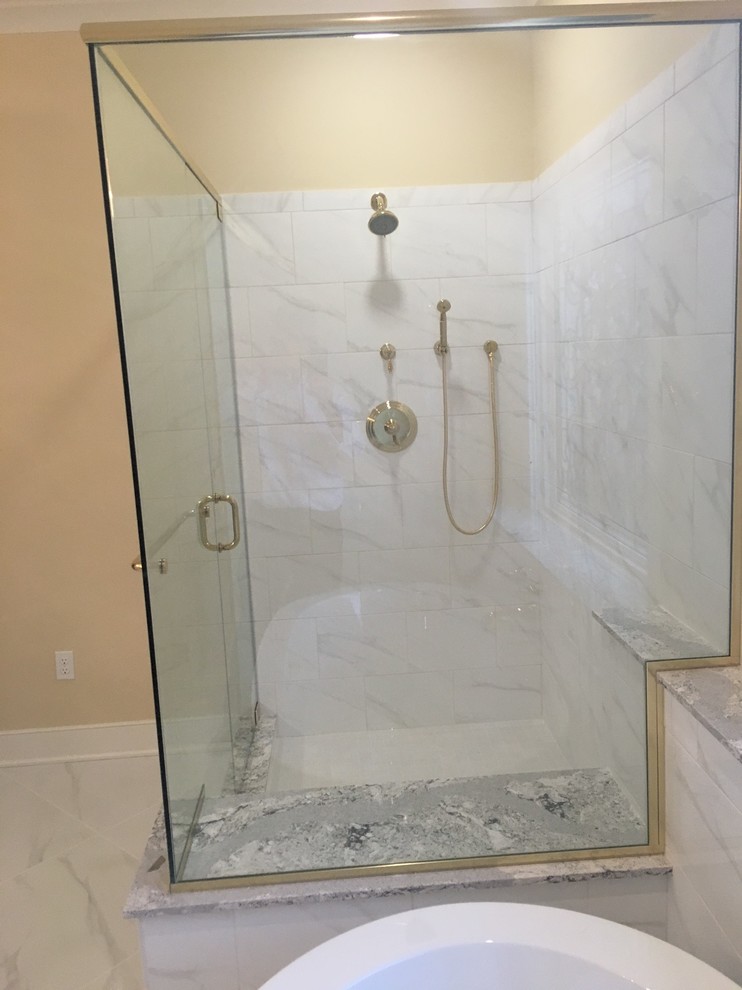 Example of a large classic master white tile and stone tile marble floor bathroom design in Louisville with white cabinets, raised-panel cabinets, beige walls, a drop-in sink and marble countertops