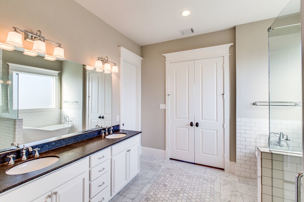 Example of a large ornate master white tile and subway tile marble floor and gray floor bathroom design in Houston with recessed-panel cabinets, white cabinets, an undermount sink, granite countertops, a two-piece toilet, gray walls and a hinged shower door