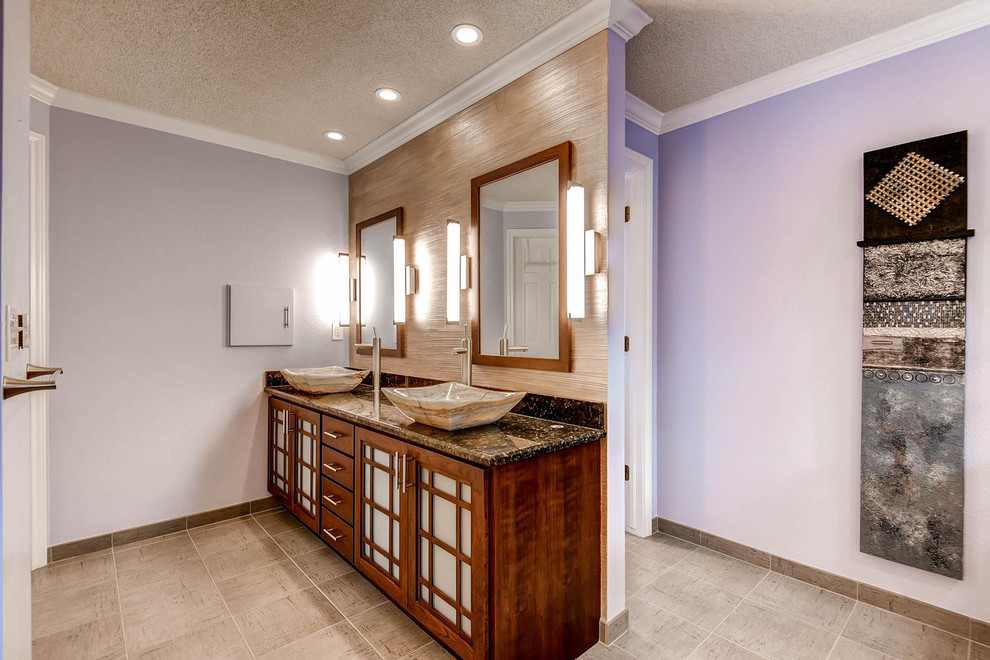 Inspiration for a large world-inspired ensuite bathroom in Denver with a vessel sink, shaker cabinets, medium wood cabinets, granite worktops, a japanese bath, a corner shower, a two-piece toilet, grey tiles, ceramic tiles, purple walls and ceramic flooring.