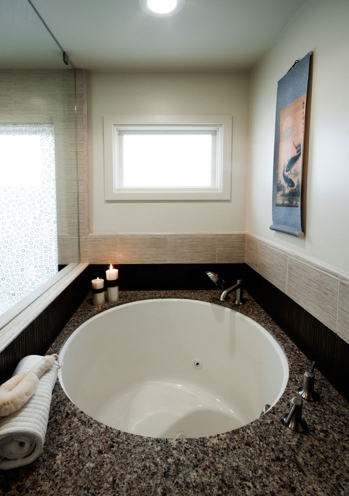 This is an example of a contemporary bathroom in San Diego with a submerged sink, dark wood cabinets, engineered stone worktops, a japanese bath, beige tiles and porcelain tiles.