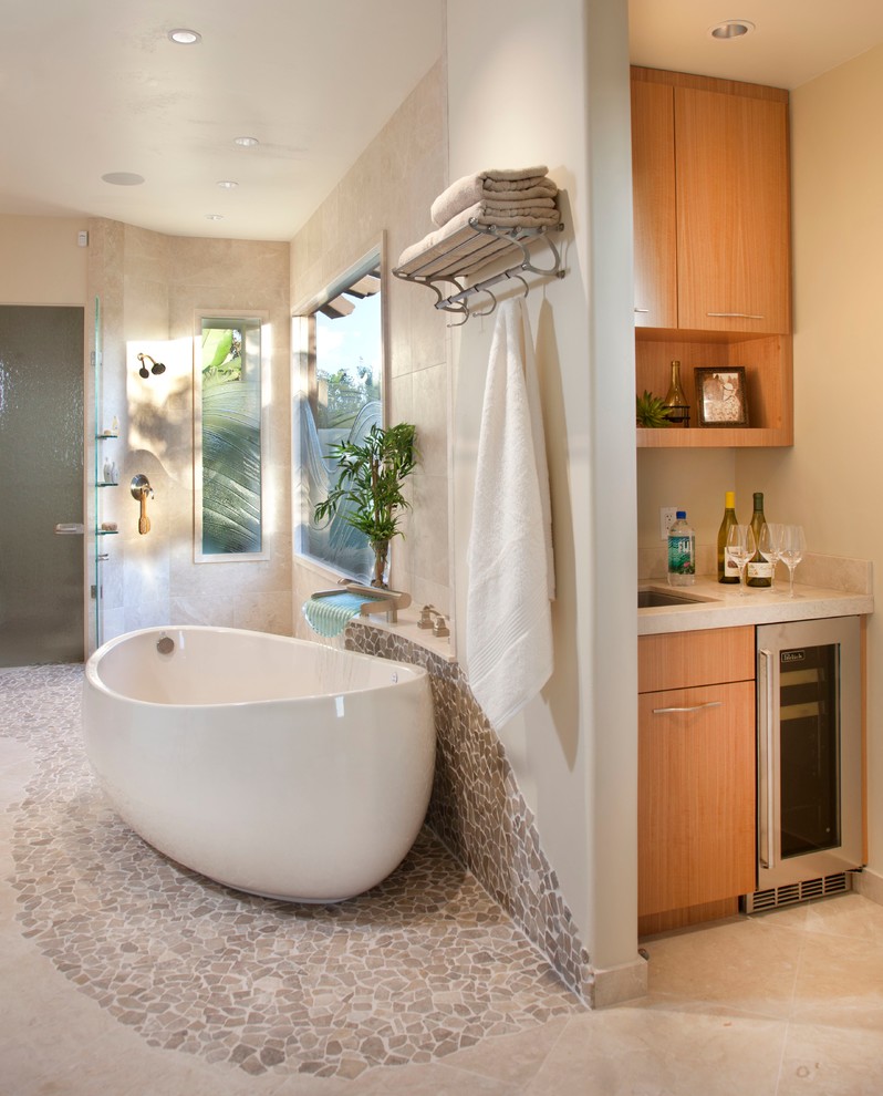 Inspiration for a medium sized contemporary ensuite bathroom in San Diego with flat-panel cabinets, light wood cabinets, engineered stone worktops, a freestanding bath, a built-in shower, white walls and porcelain flooring.