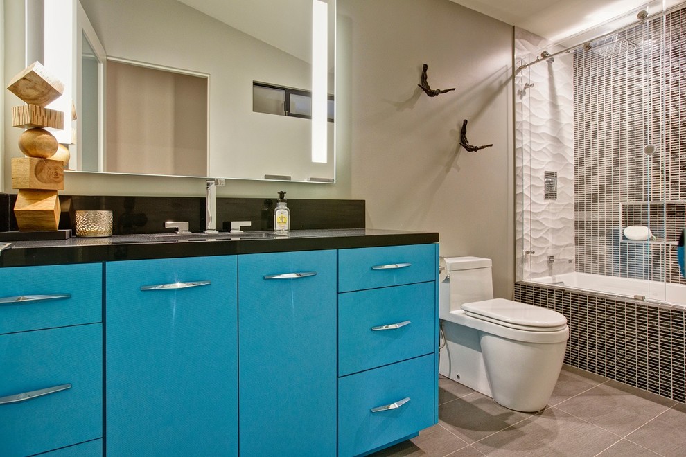 Mid-sized trendy master mosaic tile porcelain tile bathroom photo in San Diego with an integrated sink, flat-panel cabinets, blue cabinets, quartz countertops, a two-piece toilet and blue walls