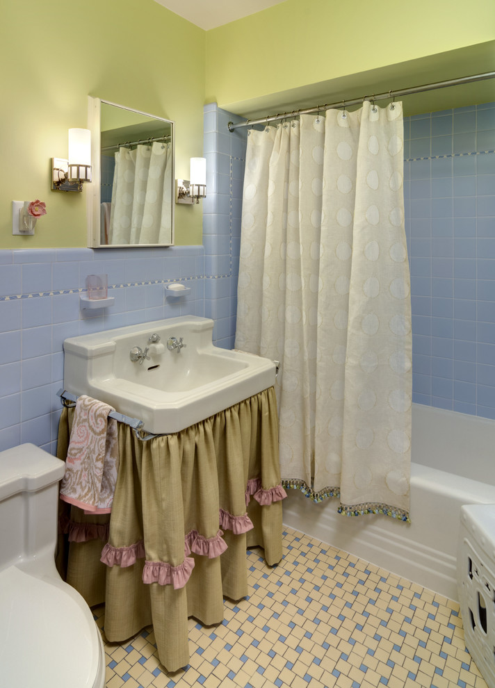 Bathroom - small traditional kids' ceramic tile and blue tile ceramic tile and yellow floor bathroom idea in Minneapolis with green walls and a console sink