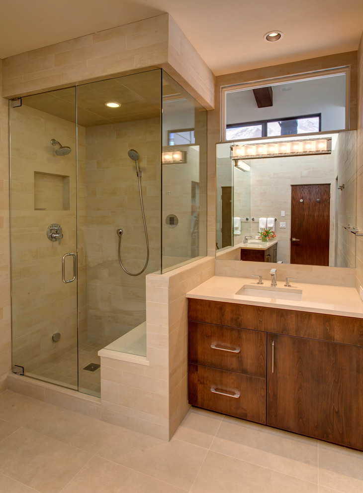 Idée de décoration pour une petite salle de bain design en bois brun avec un placard à porte plane, WC séparés, un carrelage beige, des carreaux de porcelaine, un mur beige, un sol en carrelage de porcelaine, un lavabo encastré et un plan de toilette en surface solide.